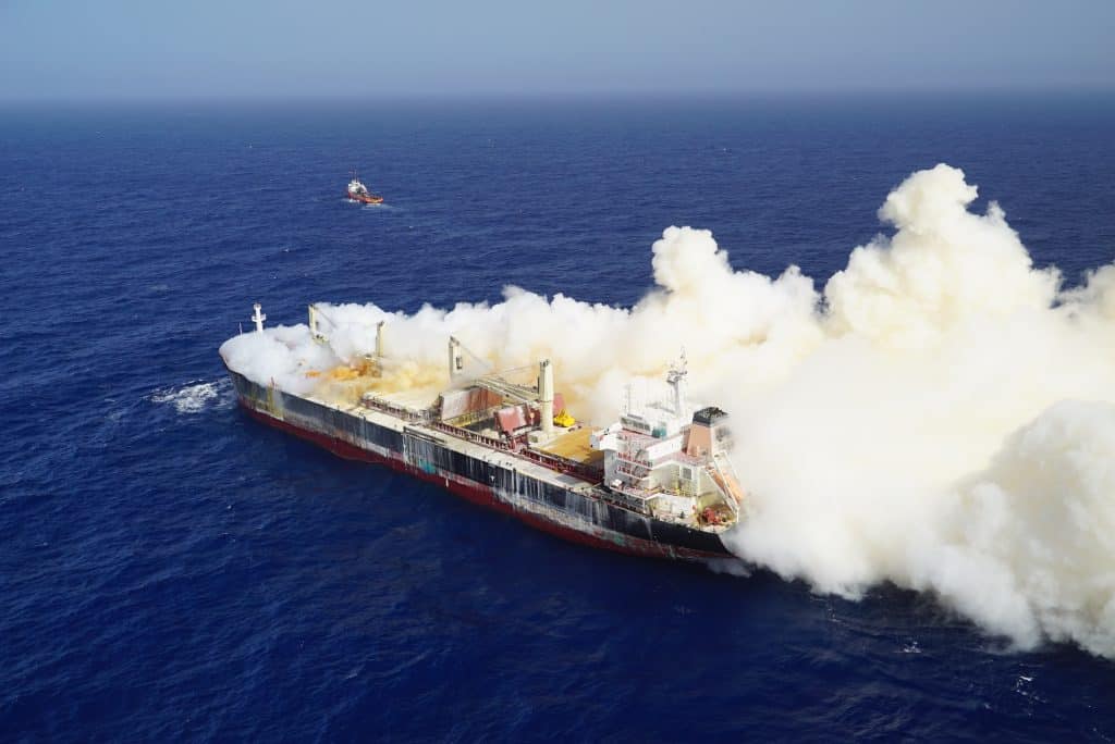 Ship on fire in middle of ocean