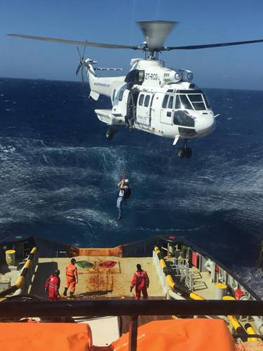 Joey Farrell pictured being lowered by helicopter onto a ship