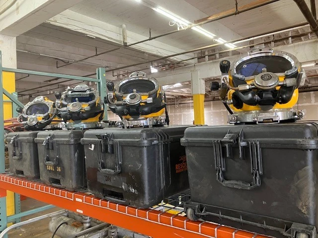 Photo of a set of dive helmets inside of the facility