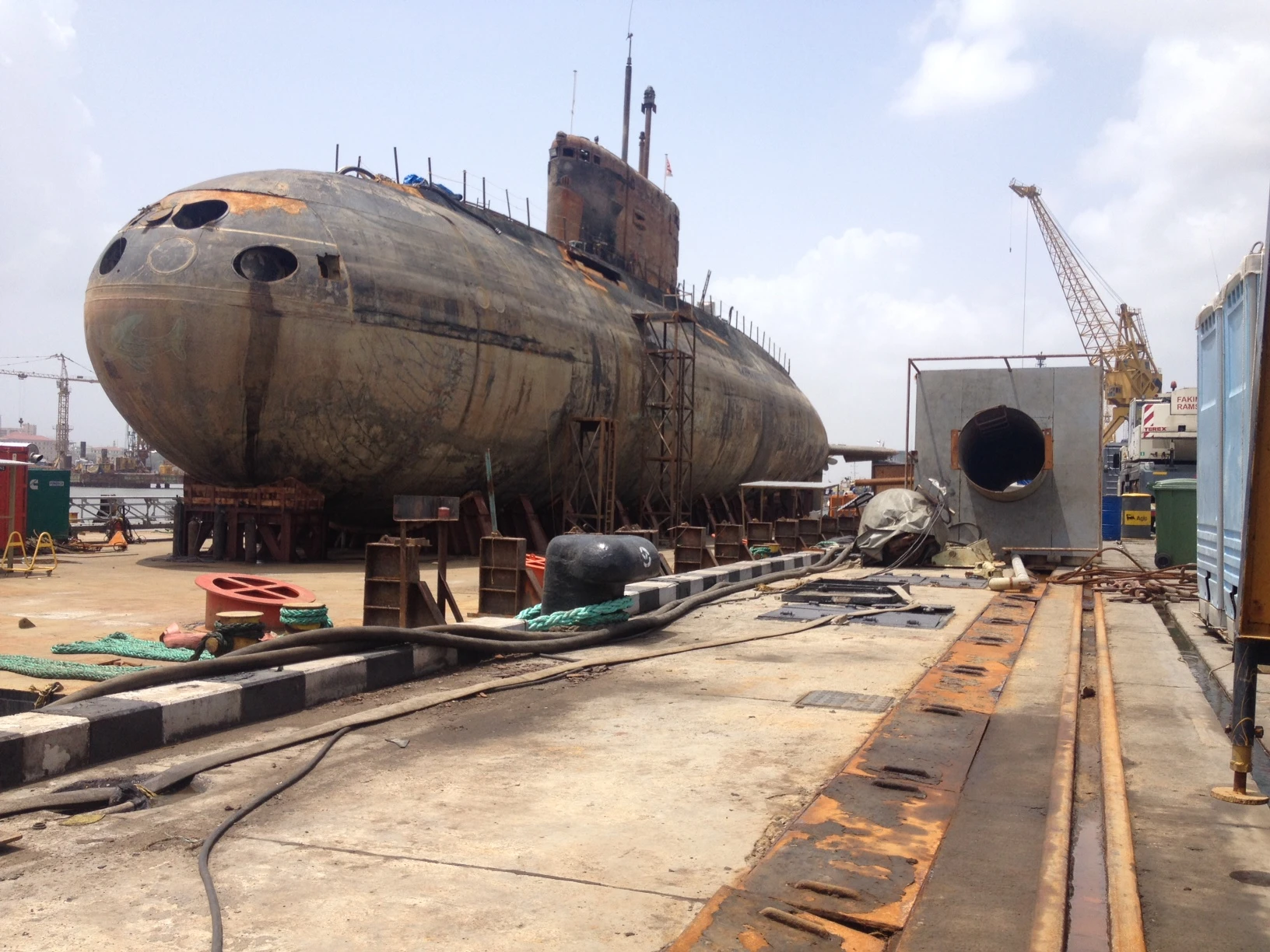 A rusty submarine out of water