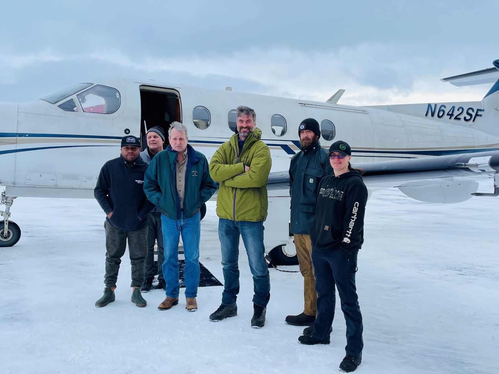 Crew change in Anchorage: Jessica heads to Dutch Harbor (L-R AB Ernie Rogers, Craig Walters (pilot), Rolf Ekenes (Chief Engineer, Pioneer), Capt. Jacob Bick (Makushin Bay), Justin Deane (Engineer, Makushin Bay and Jessica Gaisbauer (First Assistant Engineer, Pioneer)